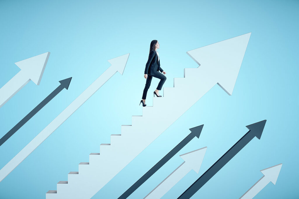 woman climbing staircase representing growth