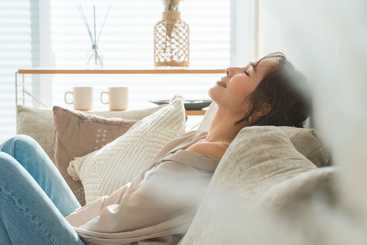 woman resting on couch